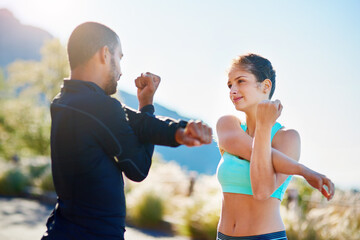 Man, woman and outdoor stretching for exercise warm up or arm mobility on mountain path, coach or...