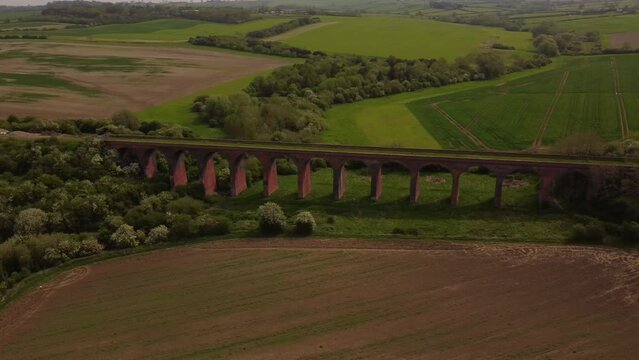 An aerial view of the Ledbury Viaduct bridge in England during daylight
