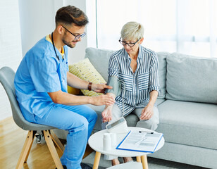 nurse doctor senior care caregiver help check exam blood pressure check pulse retirement home stethoscope nursing elderly man woman health