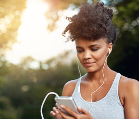 Fitness, black woman and smartphone with headset for listening music, podcast and radio with smile....