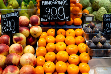 Mandarins, nectarines, figs for sale. Fresh and organic vegetables and fruits at farmers market....
