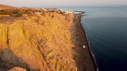 Aerial Reveal Shot of Santorini Volcano. Volcanic Rock Island in Aegean Sea Greece