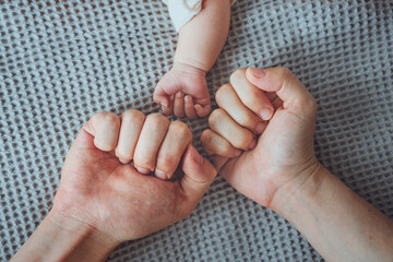 Fist of father with mother and newborn baby, Family concept