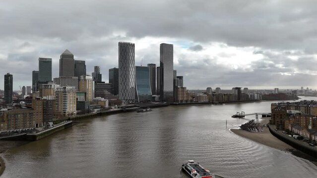 Stormy skies over Canary wharf financial district London UK drone aerial view