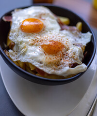 fried eggs and french fries