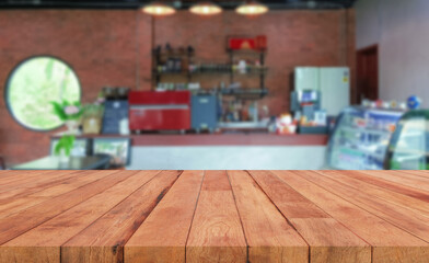 perspective wooden board over blurred coffee shop