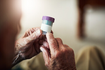 Senior person, hands and reading prescription with pills for illness, medication or sickness at old...
