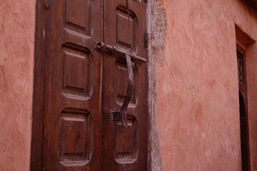 entrance wooden old carved doors Morocco in oriental style, traditional oriental shades, ornate wooden doorways in old city, Eastern craftsmanship
