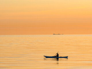 Serene Sunset Kayaking on the Calm Sea Waters of Sweden