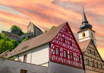 View of the castle with church in Pottenstein in Franconian Switzerland, Bavaria at sunset
