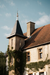 Obraz premium Rooftop spire on a French building, European rural architecture, slate roof tiles