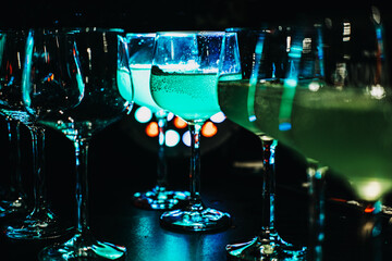 Green Cocktails Served at a Bustling Nighttime Bar