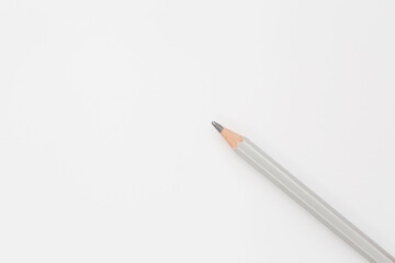  pencil laying on white blank sheet of paper
