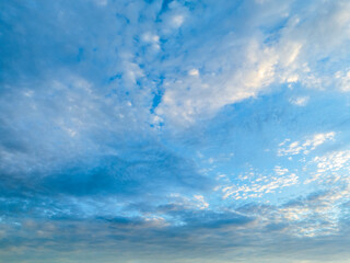 Blue sunrise sky with clouds