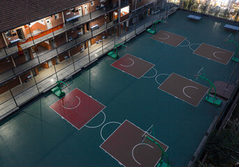 Brightly-lit middle school playground in Wuhan, China, illuminated by the lights of the building