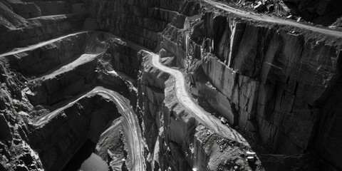 Scenic black and white photo of a road in a canyon. Perfect for travel and nature themes - Powered by Adobe