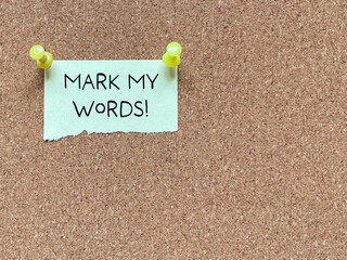 Mark my words on notice board background. Stock photo.