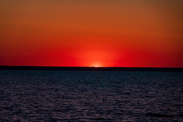 sea under the sunlight during a beautiful sunset in the evening.