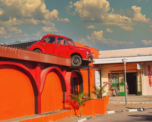 red car in top of a building, advertising in a mall