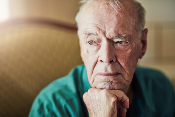 Elderly, man and sad with thinking of memory in retirement home with remember, nostalgia or...