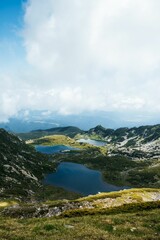 Obraz premium Stunning aerial view of the Seven Rila Lakes against a cloudy sky in Bulgaria