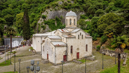 the hydroelectric dam and the church on the Psyrtskha River in New Athos.