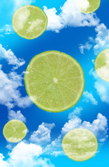 Flying slices of citrus fruits (limes) in the dark blue sky among clouds. Illustration: photos blended with graphics. 