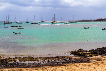Obraz premium Sailboats and boats moored in Corralejo harbour. Fuerteventura, Canary Islands, Spain