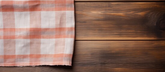 Wooden background with a kitchen cloth napkin and empty space for text. with copy space image. Place for adding text or design