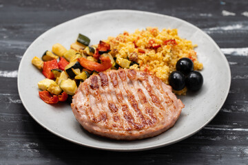 Delicious grilled chicken burgers served with baked vegetables
