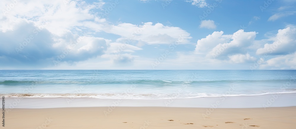 Poster Tranquil serene landscape featuring a wide empty sand beach adorned by a beautiful cloudy sky offering a perfect atmosphere for relaxation Ample copy space image available for creative usage