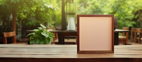 Fototapeta premium A wood table tent with a blank copy space image sits on a cafe table embodying the concept of reservations
