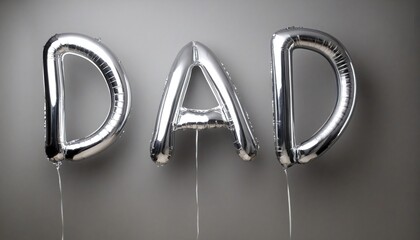 silver foil balloons in the shape of the word dad
