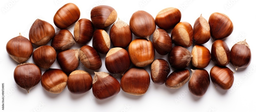 Poster a top down view of a pile of sweet chestnuts isolated on a blank white background the copy space ima