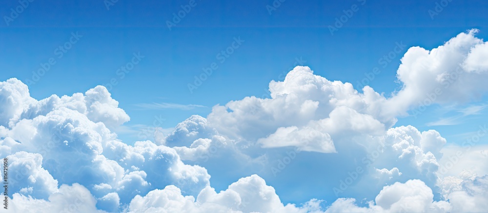 Aufkleber The image shows a clear blue sky with fluffy white clouds in the background. with copy space image. Place for adding text or design