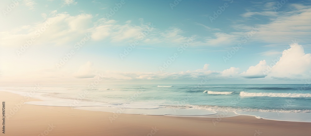 Aufkleber a serene empty beach emerges as the tide recedes offering a perfect backdrop for a copy space image