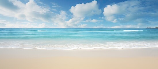 Tranquil serene landscape featuring a wide empty sand beach adorned by a beautiful cloudy sky offering a perfect atmosphere for relaxation Ample copy space image available for creative usage