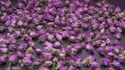 Purple dried rose buds flower background