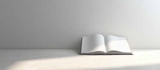 The image shows a blank book and a newspaper placed on a light background leaving empty space for...