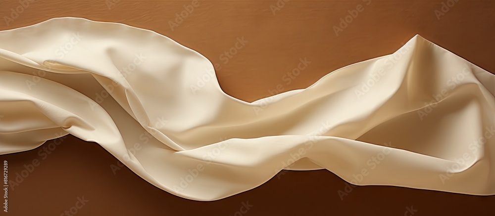 Poster a white sheet of crumpled paper contrasts against a brown paper background providing a clean area fo