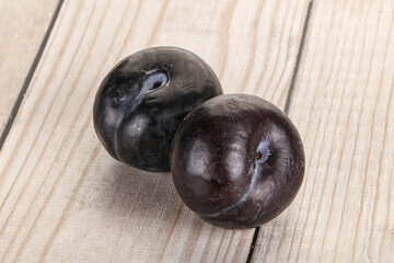 Two ripe sweet black plums