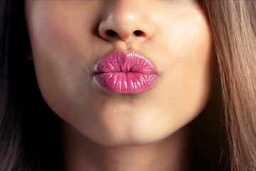 Woman, zoom and kiss with lipstick for beauty or aesthetics, gloss or shine with makeup. Female...