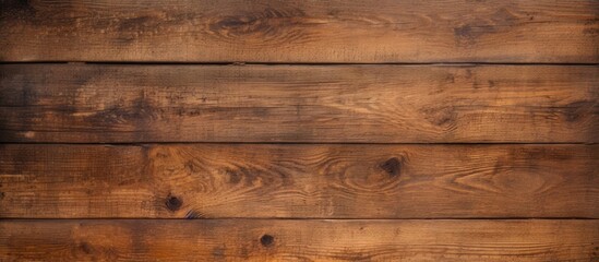 A weathered wooden background with an old brown texture offering copy space for images