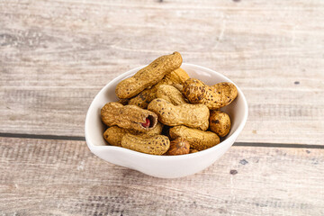 Raw ripe unpeeled peanut heap