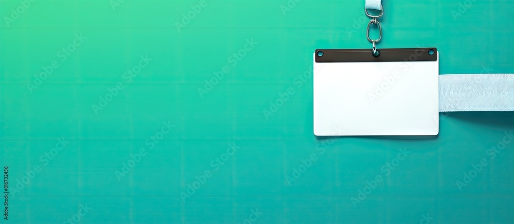 Aufkleber Top view of a green background displaying an empty white ID card badge mockup with blue belts This copy space image is perfect for staff identity name tags allowing room for text and design