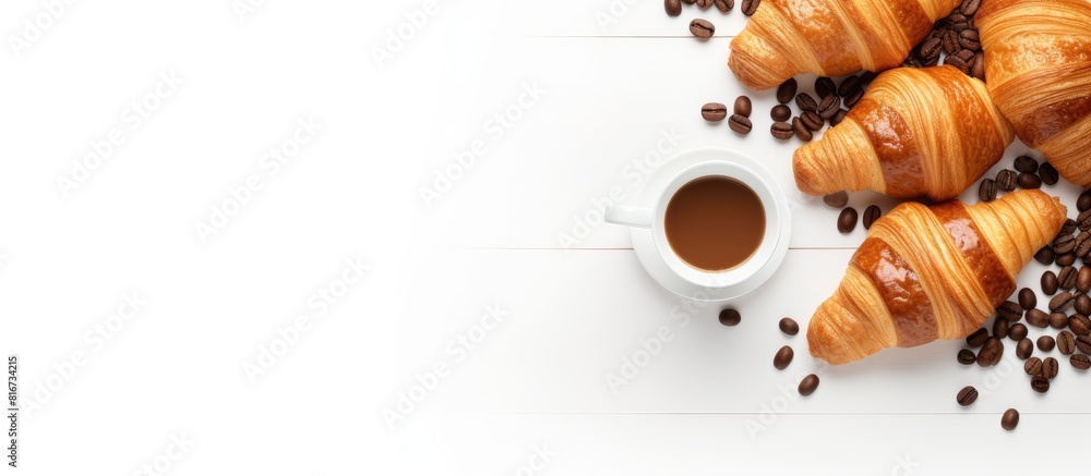 Poster A top down view of a white background showcasing a delightful morning spread of aromatic coffee and sweet croissants with plenty of copy space