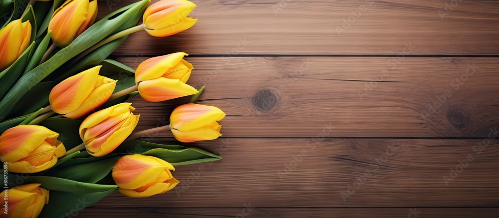 Poster a stunning image of yellow tulips on a wooden backdrop with ample copy space