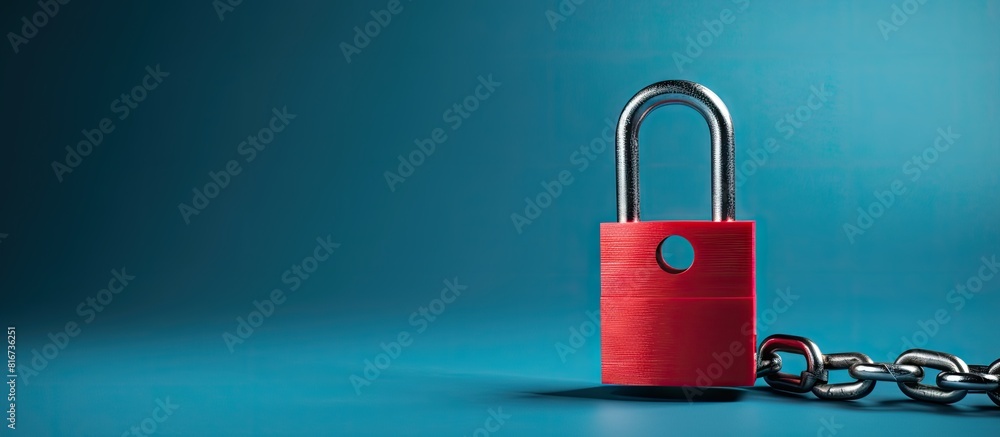 Poster A safety concept is illustrated with a red chain and padlock against a blue background creating copy space for additional content