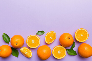 fresh Fruit orange slices on colored background. Top view. Copy Space. creative summer concept. Half of citrus in minimal flat lay with copy space