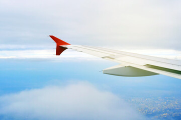 Wing of the plane on sky background